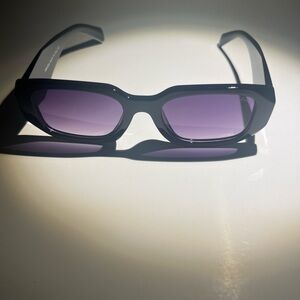 Stylish Black Prada Sunglasses with Purple Lenses
